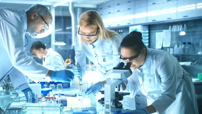 Team of Scientists Working in Laboratory